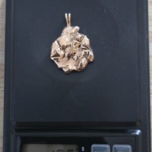 10.4 grams 10-14k sold gold pendant. Professionally tested. Scrap or wear.